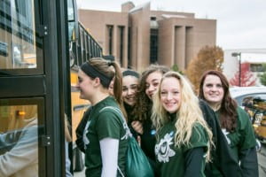 Volunteers loading buses for UWGB Make a Difference Day